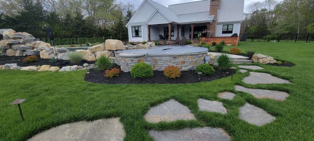 Boulder water feature with stepping stone path