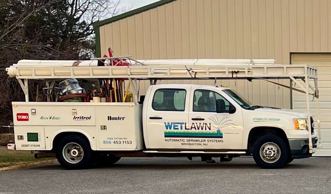 Wetlawn service truck showing Toro, Rain Bird, Irritrol and Hunter dealer badges