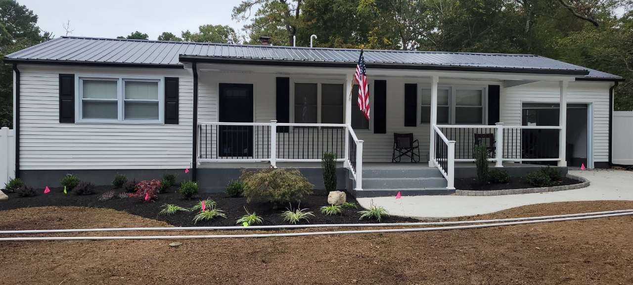 Mulched front beds with Japanese maple and grasses