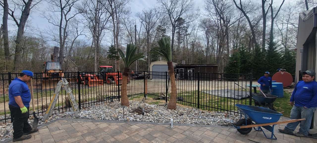 Wetlawn crew laying a paver patio